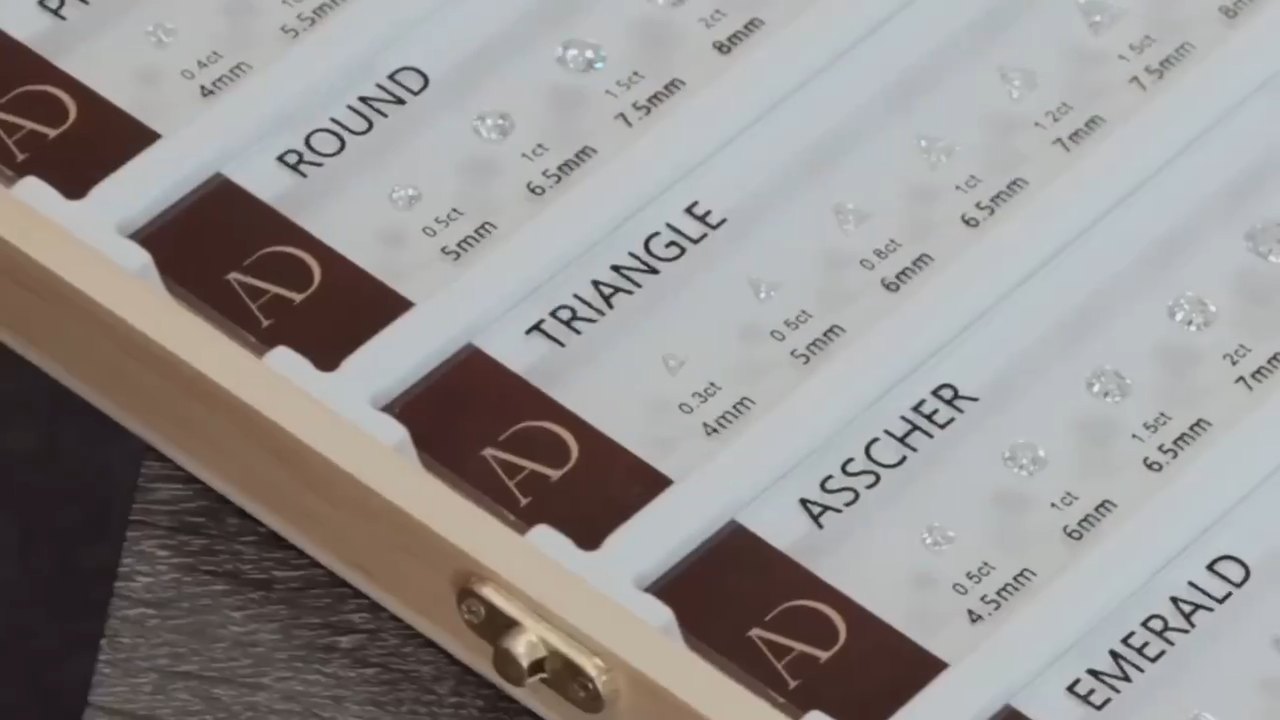 A short film of the Aura showroom: the diamond shape tray, ring boxes and a ring tried on the hand